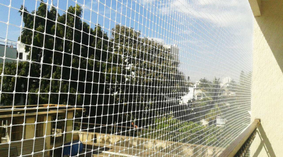 Balcony with invisible grill offering clear view and safety in a Hyderabad apartment